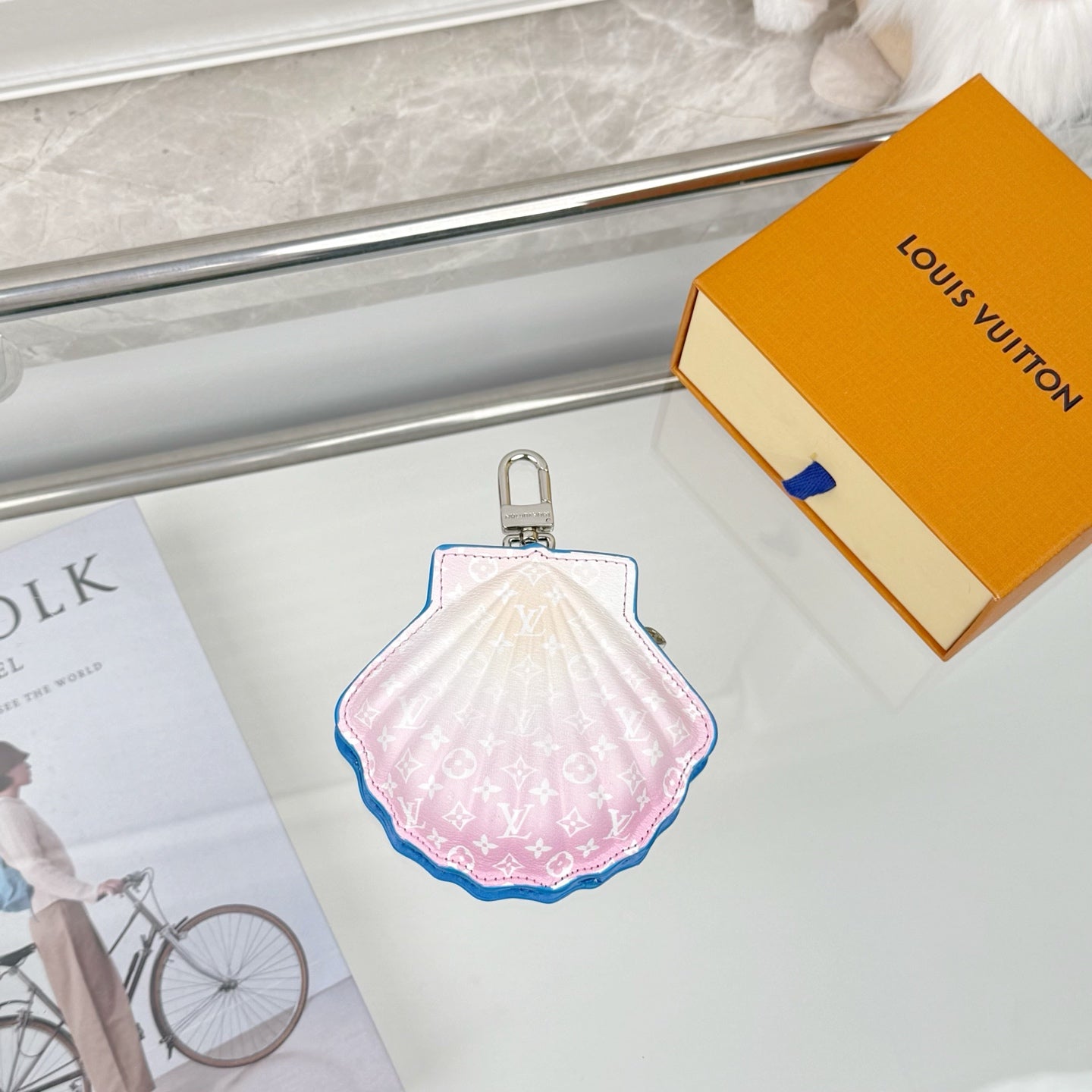 Louis Vuitton scallop mini pouch in pink with blue trim and metal keyring.