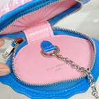 Louis Vuitton shell bag interior close-up, pink lining, blue zipper, silver chain tag