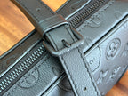 Louis Vuitton zip pull and leather tab on monogram crossbody bag with stitching.