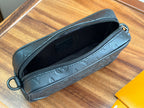 Zip-top Louis Vuitton pouch crossbody bag with black interior and round zipper edge.
