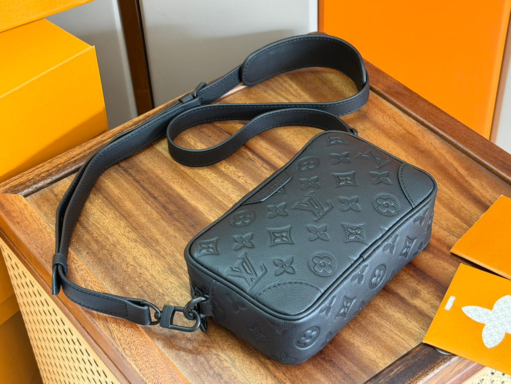 Men's Louis Vuitton dark blue monogram crossbody bag with handle strap and zip.