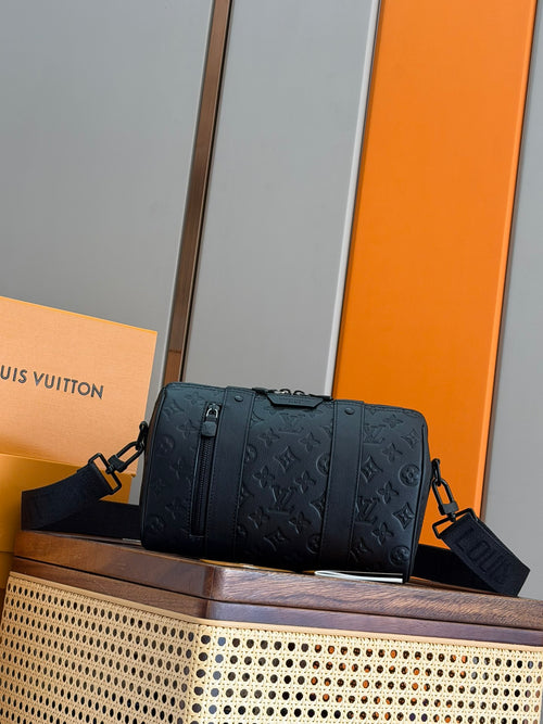 Men's Louis Vuitton shoulder bag in dark blue with embossed monogram pattern and top handles.