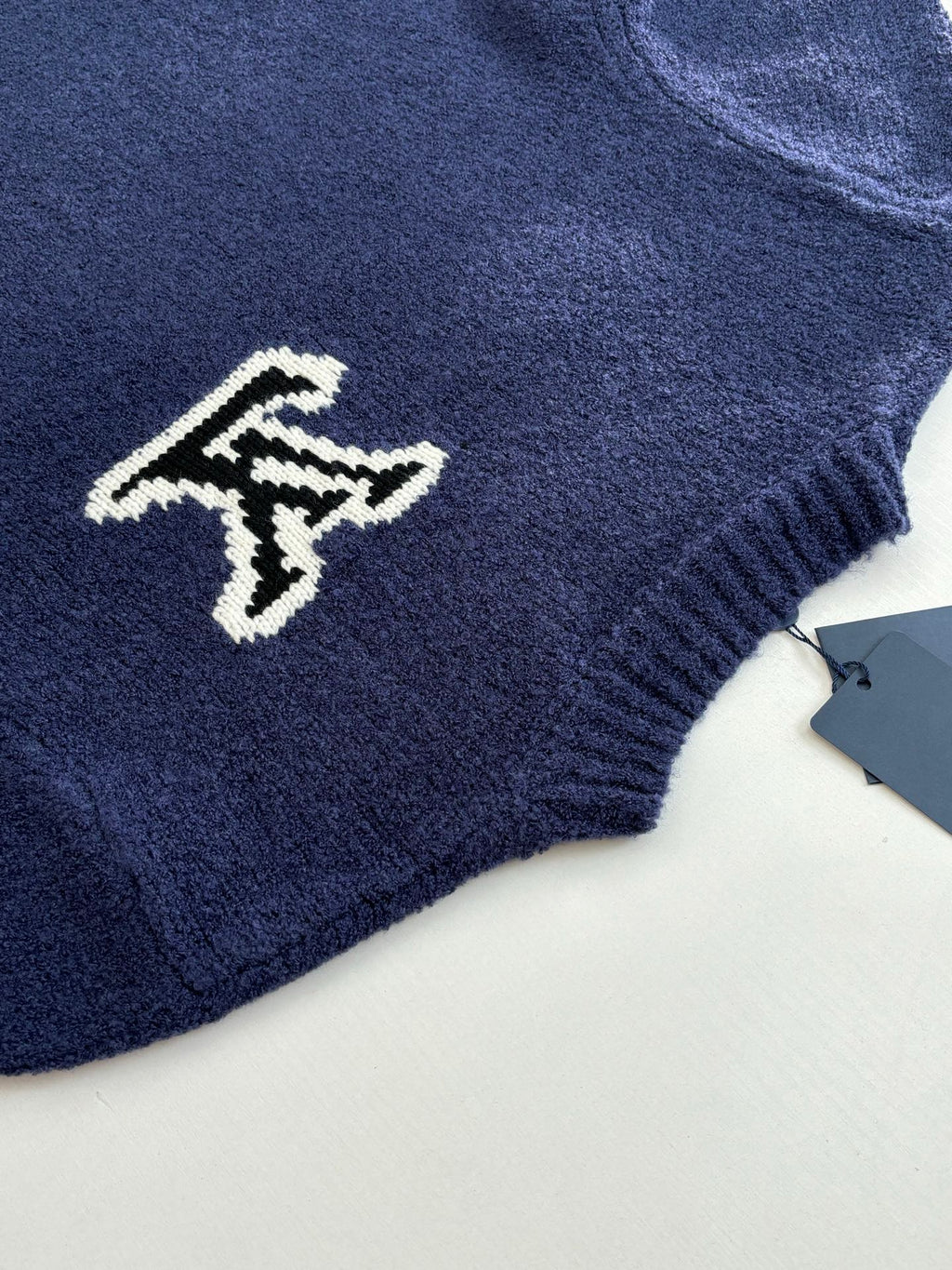 Louis Vuitton knit sweater sleeve with small white LV logo on dark blue