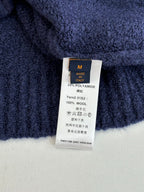 Louis Vuitton sweater care label, size M; 22% polyamide, 100% wool
