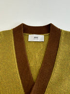 Green knit cardigan with brown neckline trim and interior brand label