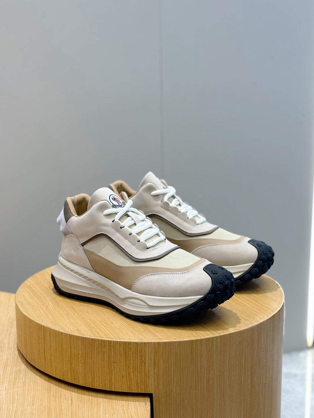 Moncler chunky sneakers, beige and cream upper with dark textured rubber sole