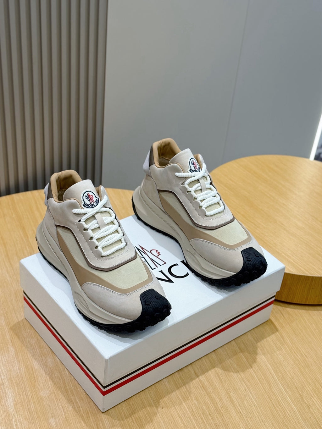 Moncler low-top sneakers in beige with white laces and dark rubber toe caps