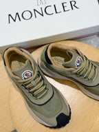 Moncler luxury shoes olive green lace-up sneakers side-by-side on display surface