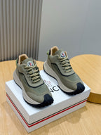 Moncler luxury shoes in olive green with navy accents, lace-up sneakers, logo patch
