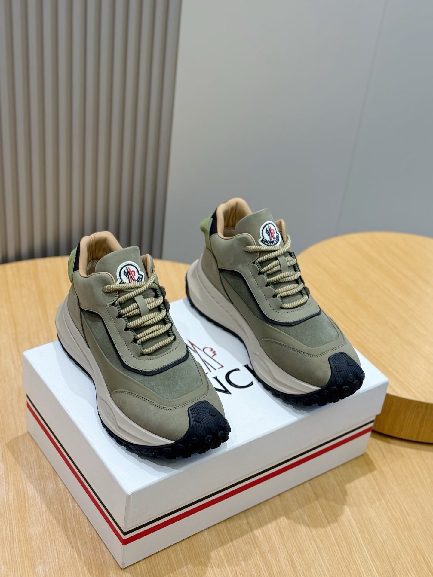 Moncler sneakers in sage green with dark navy toe and chunky rubber sole