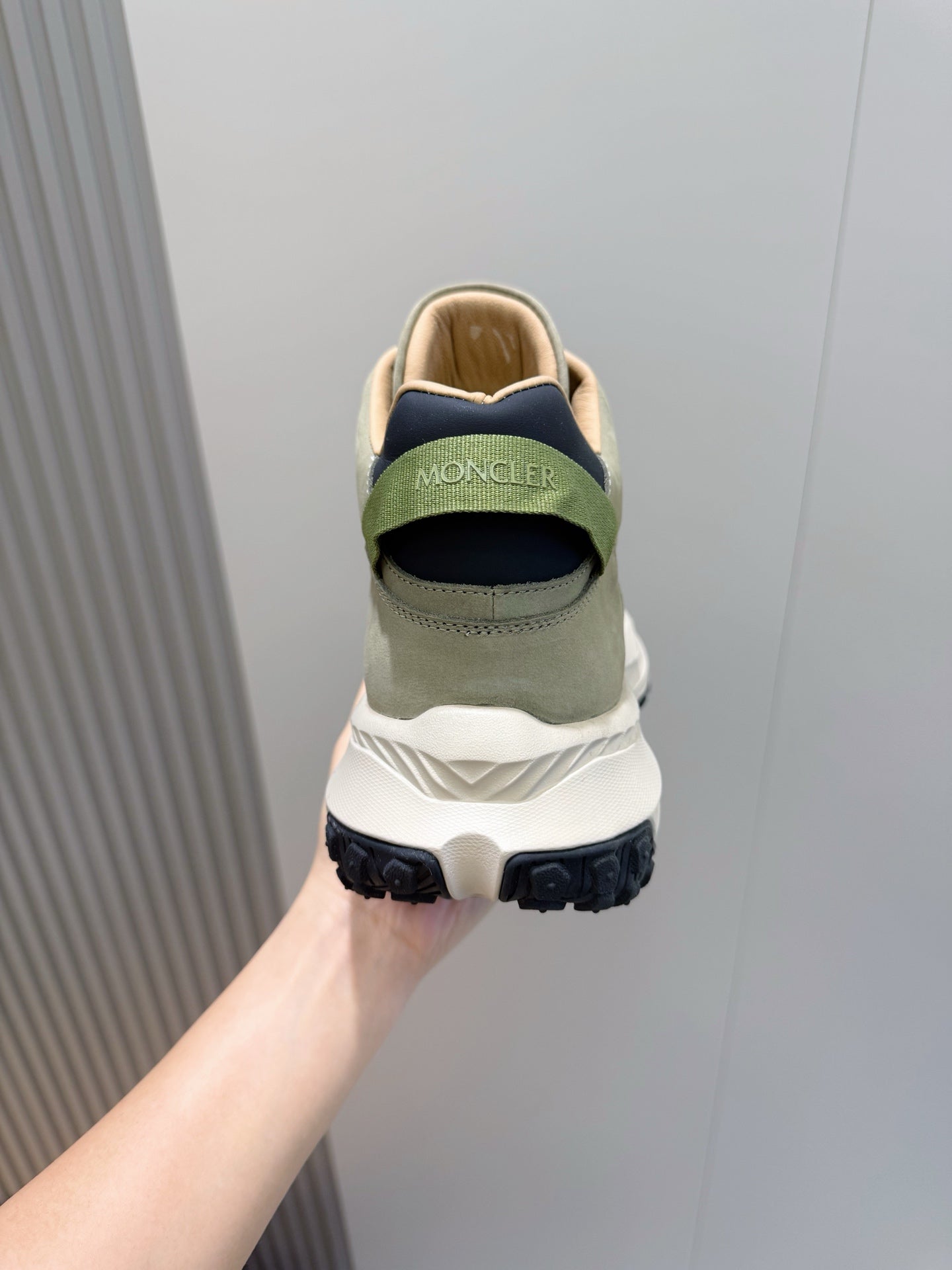 Moncler sneakers from heel, sage green with white sole and logo detail on back