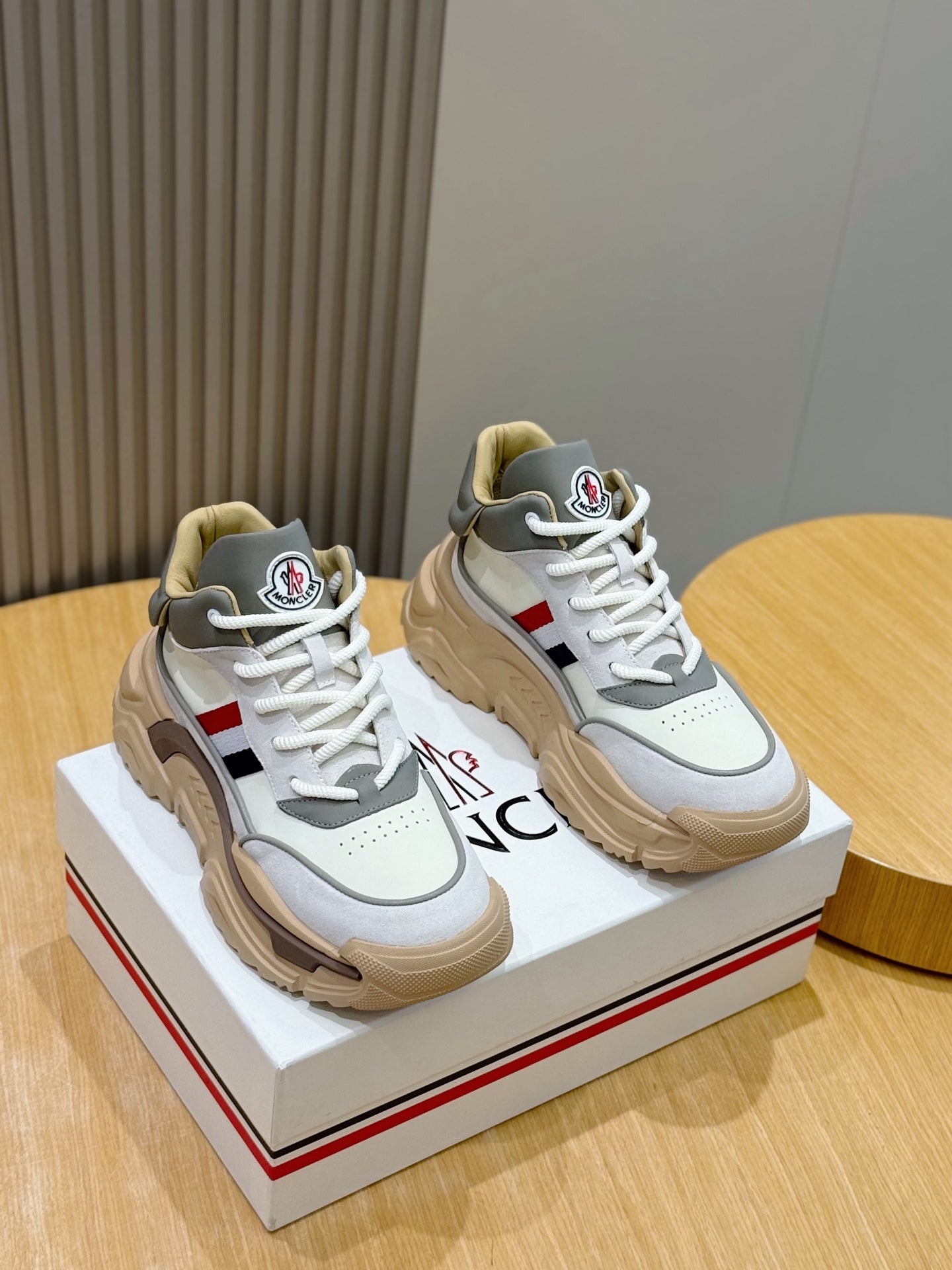 Moncler luxury sneakers, white and light blue with beige sole and logo patch