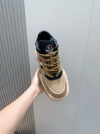 Moncler beige/navy sneaker held up, lace-up front and navy heel collar