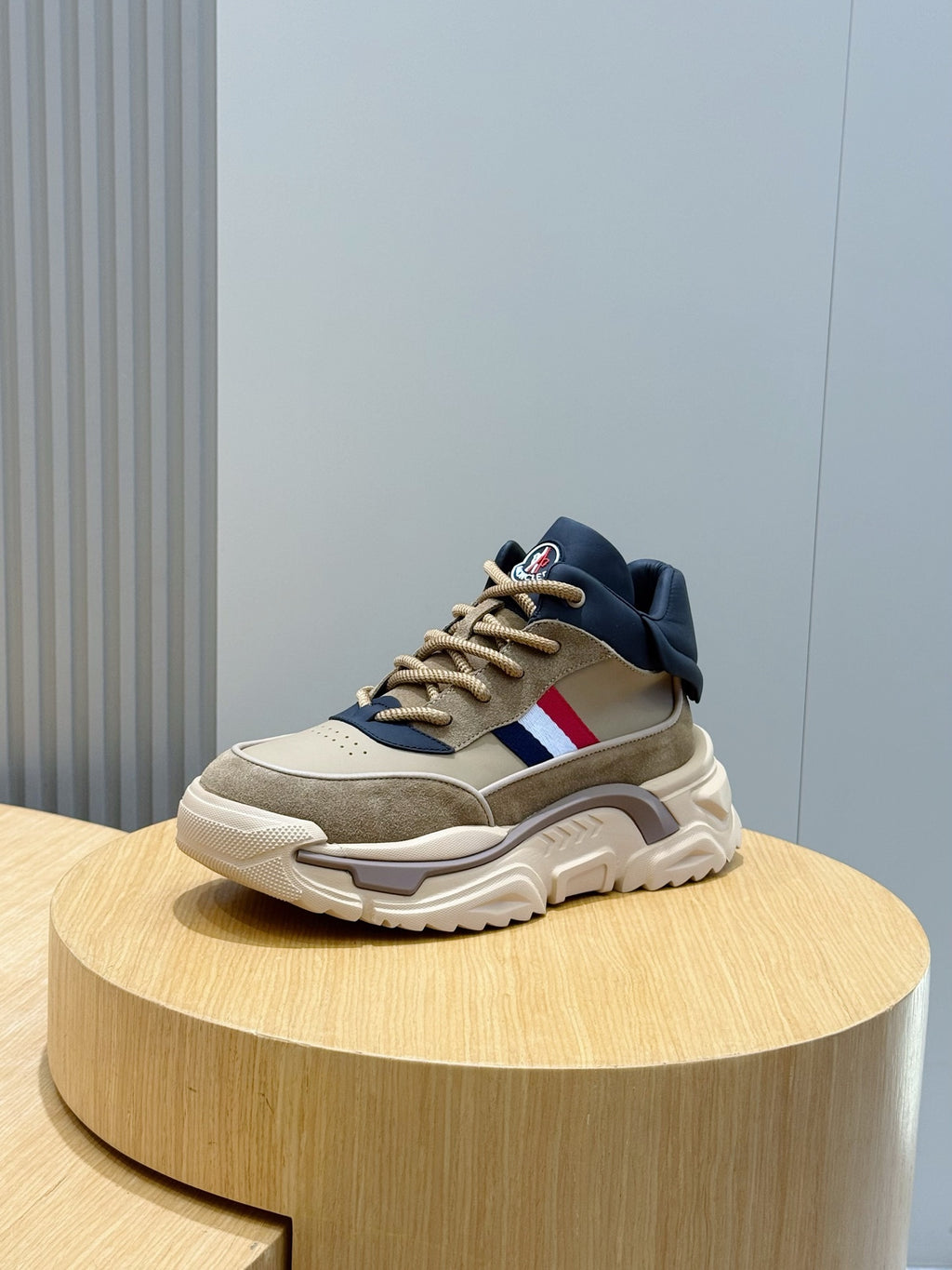 Moncler chunky sneakers, beige upper with navy trim and red-white stripe on side