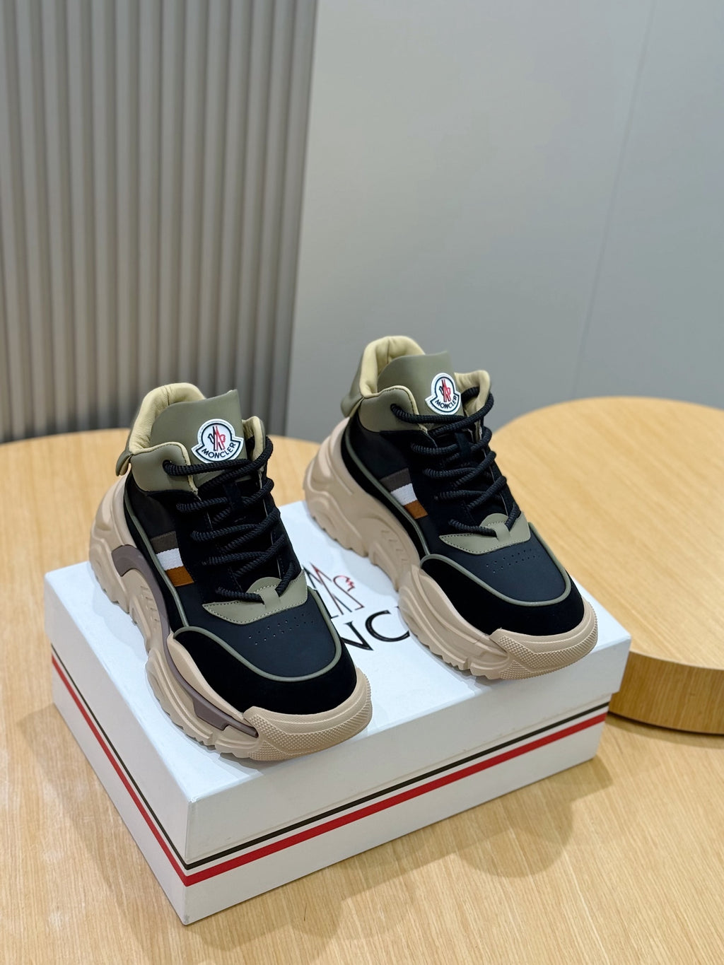 Black and beige lace-up chunky sneakers with logo patch and white side stripe
