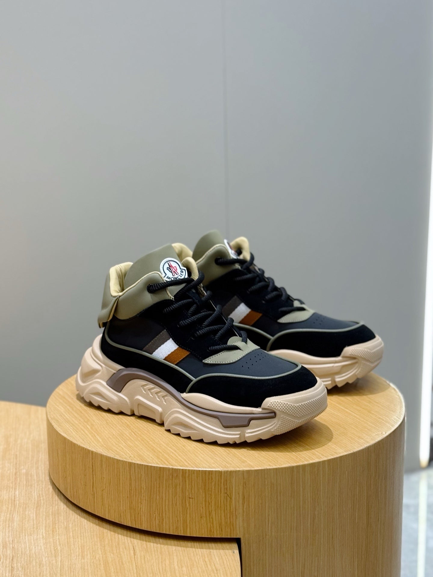 Black and beige lace-up sneakers with white side stripe and chunky midsole