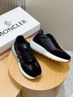 Black lace-up sneakers on display with white sole and side logo detail