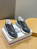 Lace-up sneakers in dark blue suede with gray N logo panels and white rubber soles