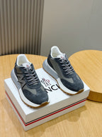 Lace-up sneakers in dark blue suede with gray N logo panels and white rubber soles