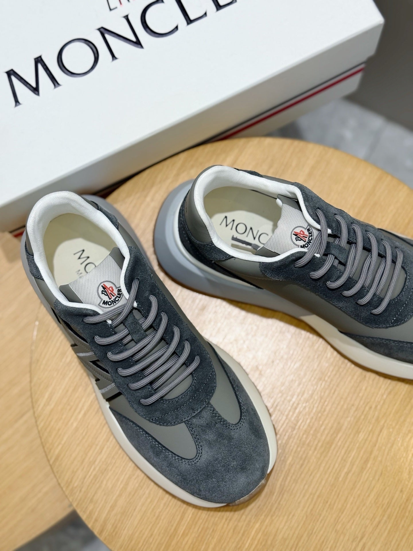 Dark blue suede lace-up sneakers with Moncler logo on the tongue and lace-up front