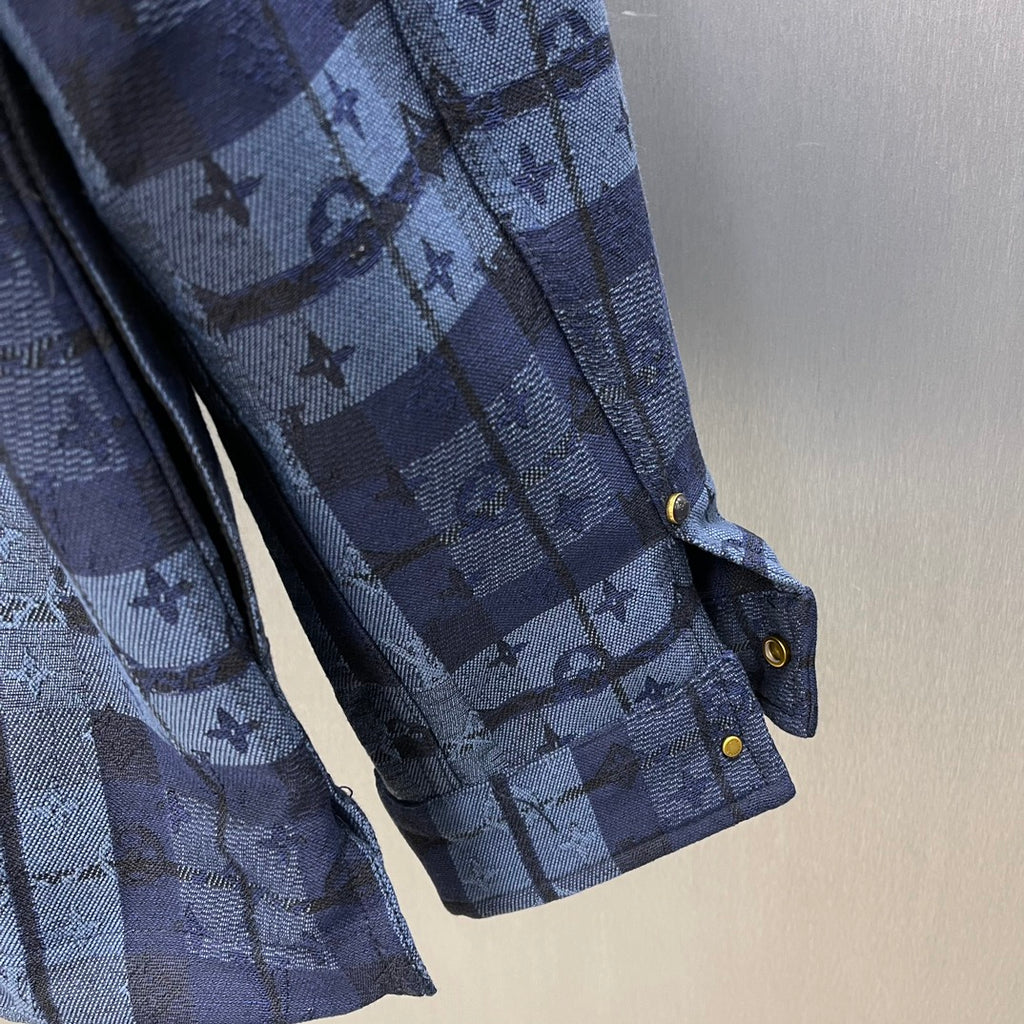 Blue patterned sleeve with cuff, gold snap button, and side pocket