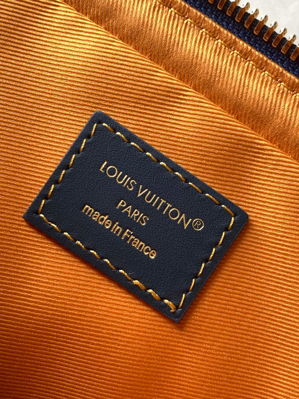 Louis Vuitton interior label card reading Louis Vuitton Paris, made in France