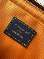 Louis Vuitton interior label card reading Louis Vuitton Paris, made in France