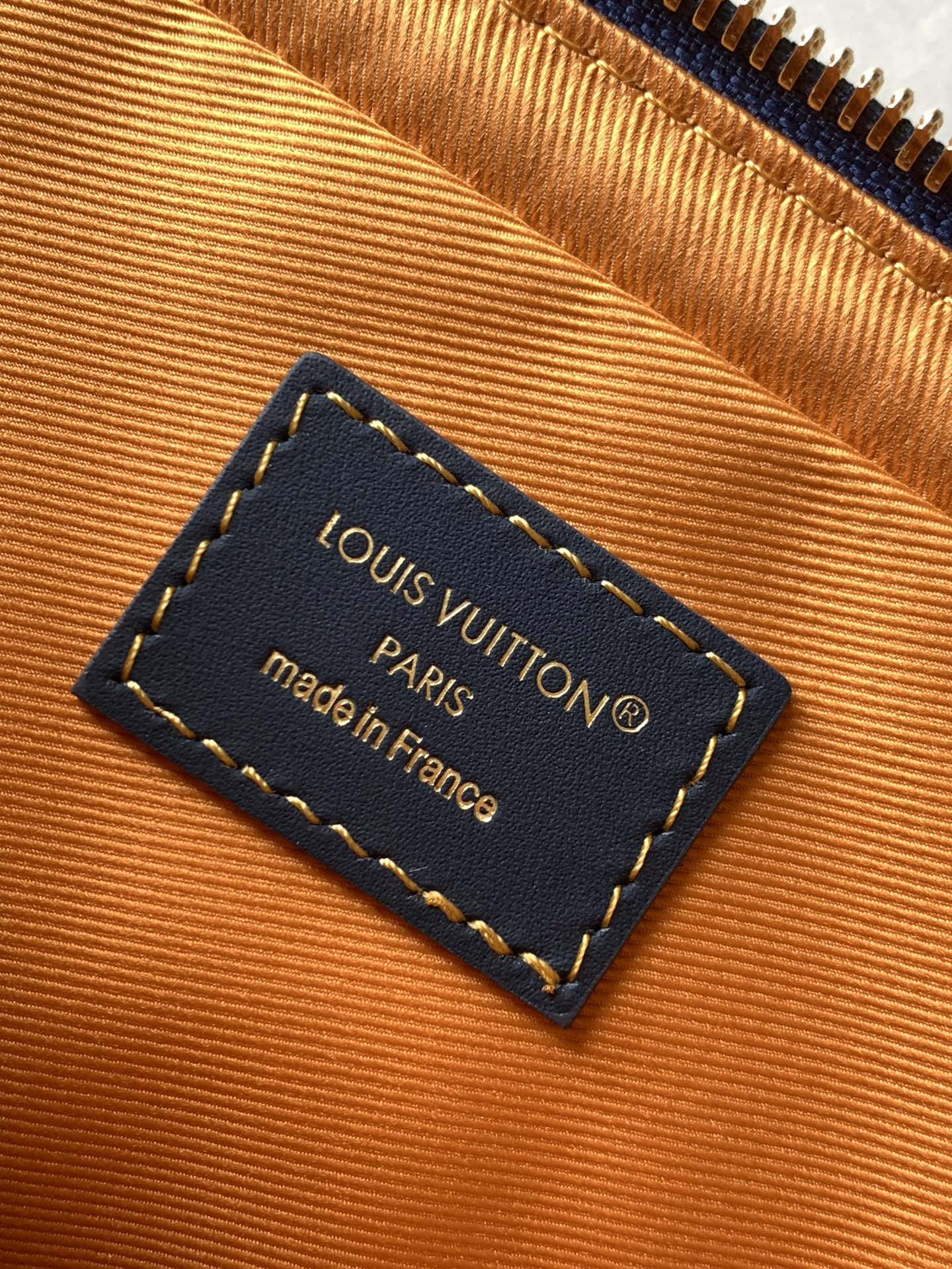 Louis Vuitton interior label card reading Louis Vuitton Paris, made in France