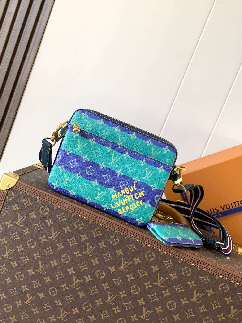 Louis Vuitton men’s crossbody bag, blue and green monogram print with gold hardware