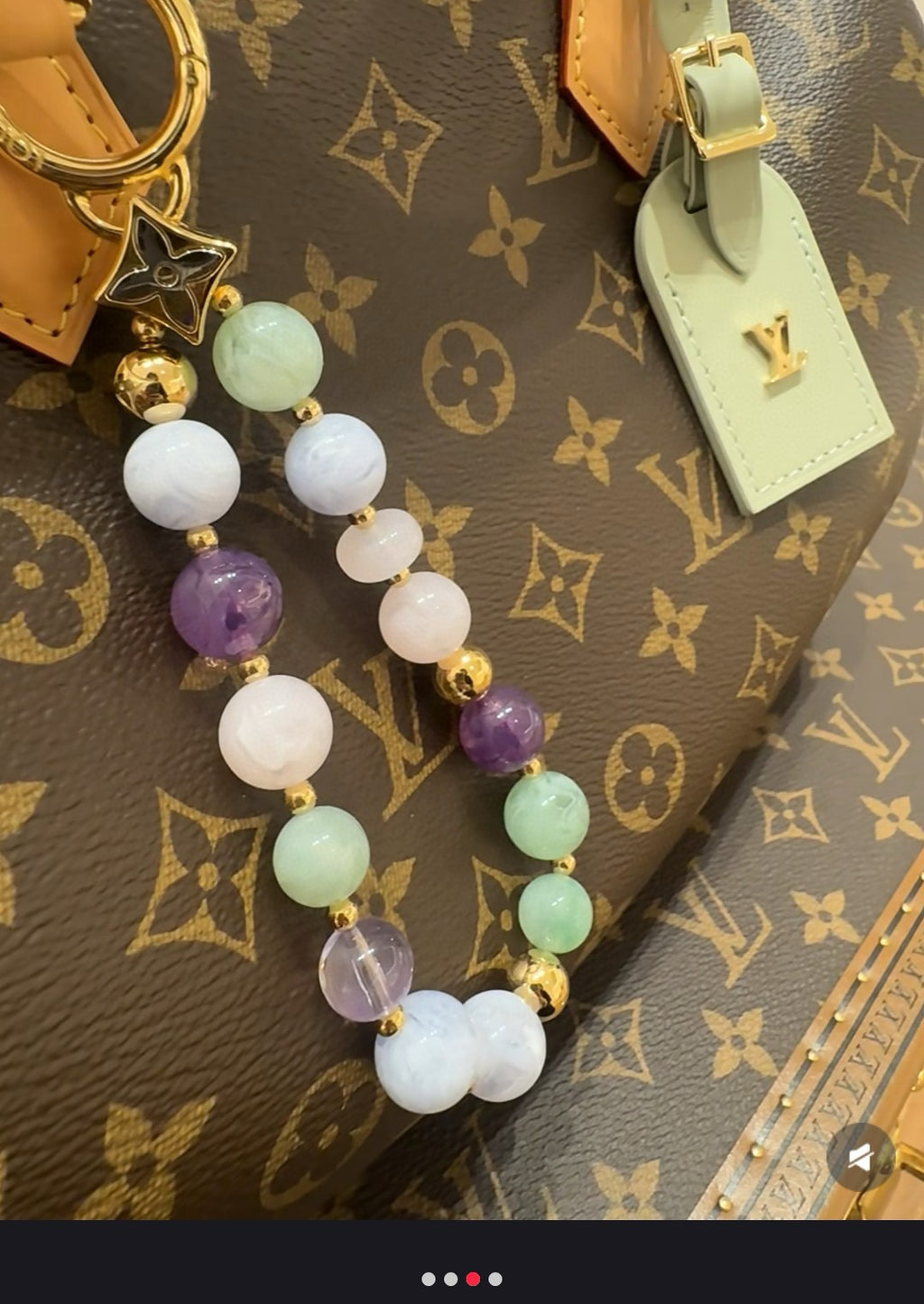 Beaded charm bracelet keychain with white, purple, and mint beads and gold spacers