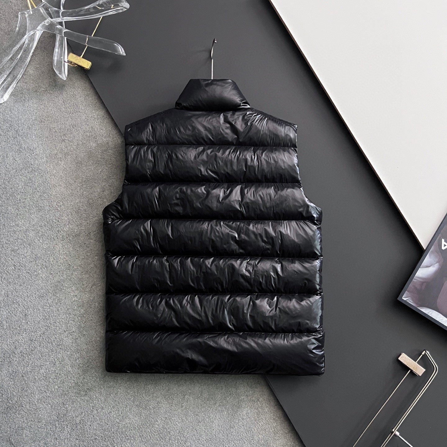 Long black puffer jacket back with quilted horizontal stitching