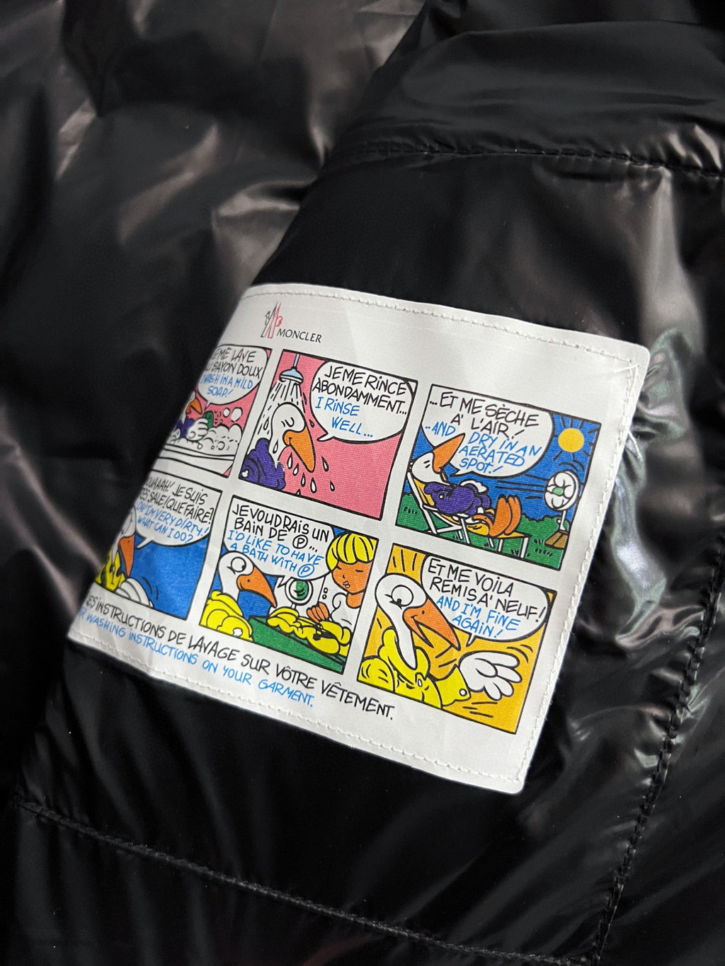 Puffer jacket inner label with colorful comic text panel