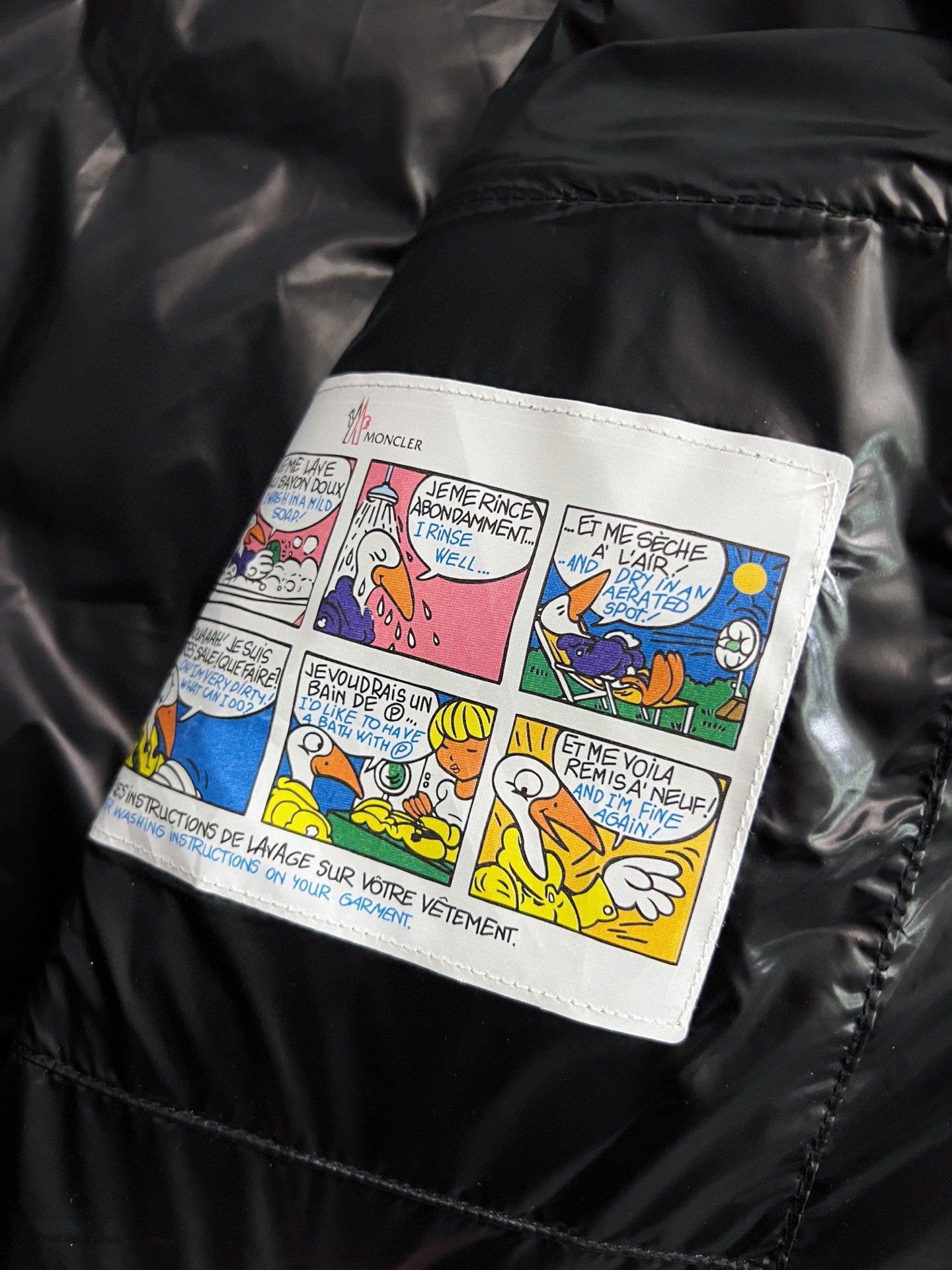 Puffer jacket inner label with colorful comic text panel