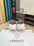 Versace low-top sneakers with brown heel backs and textured white outsole