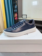 Versace low-top sneakers in dark navy with lace-up front and white rubber sole