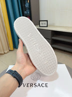 Versace sneakers sole underside in white with repeating pattern tread