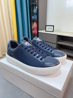 Versace sneakers in dark navy leather-look with lace-up design and white platform sole