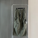 Stone Island cargo shorts in olive green with cargo pockets and front zip
