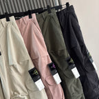 Cargo shorts on hangers in cream, pink, olive, and black with hanging tags