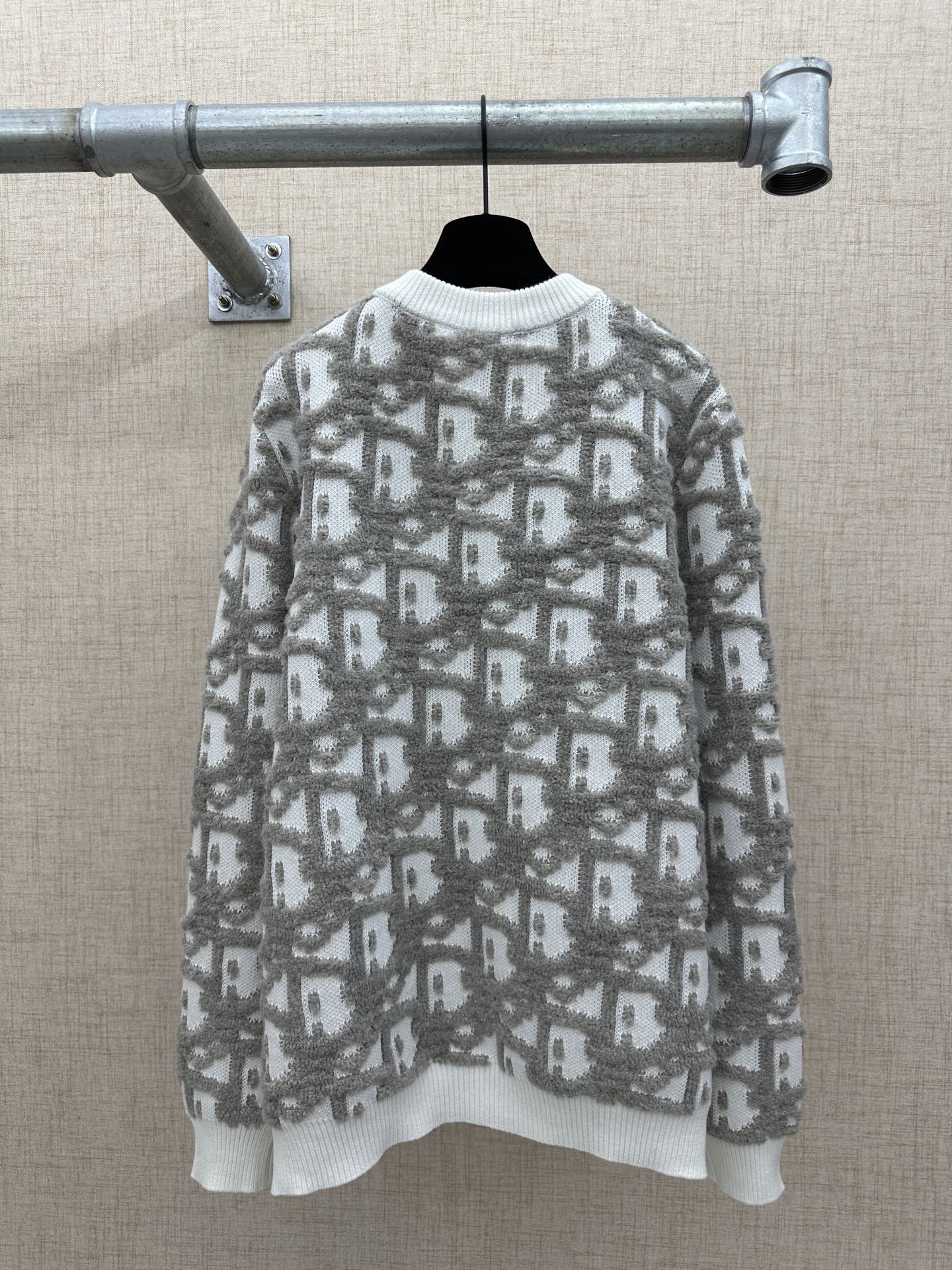 Long-sleeve knit sweater with crew neck and allover logo-like pattern in light gray