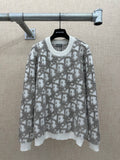 Long-sleeve knit sweater in light gray with allover logo-like print and ribbed hem