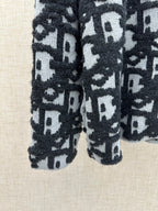 Dior jacquard knit cardigan sleeves and hem, patterned dark and white knit