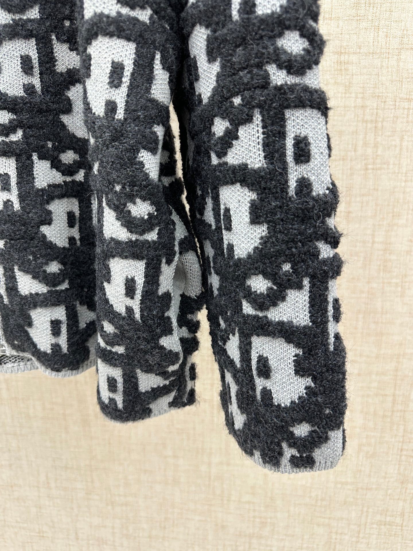 Dior jacquard knit cardigan cuff detail, patterned knit in dark and white