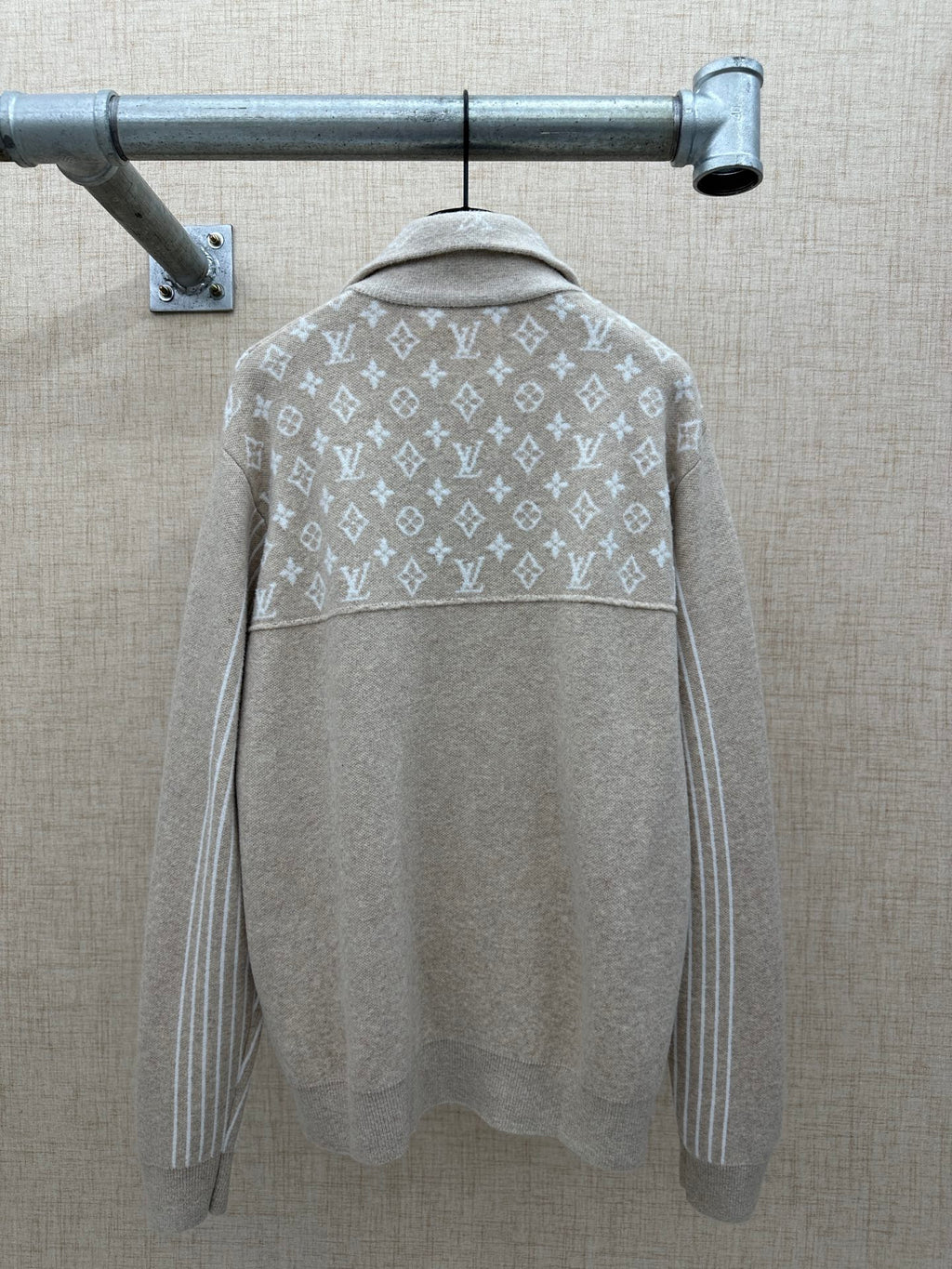 Beige hoodie back with white monogram band and hood