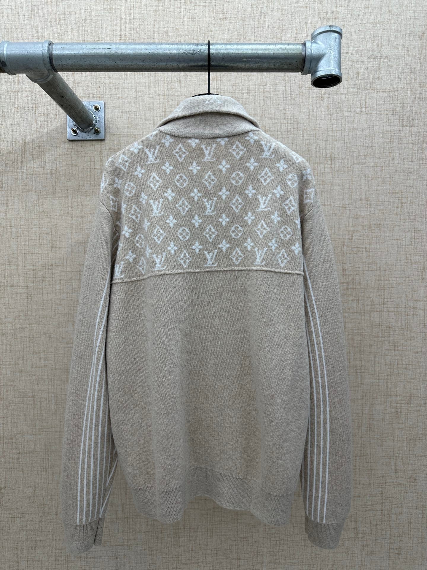 Beige hoodie back with white monogram band and hood