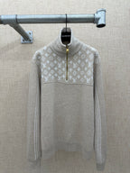 Beige long-sleeve hoodie back with white monogram pattern and front half-zip