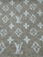Beige knit fabric with scattered white monogram motifs