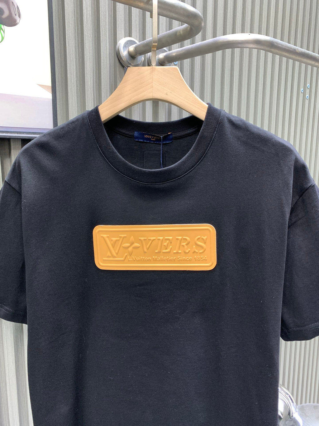 Louis Vuitton black short-sleeve T-shirt with gold rectangular LV logo