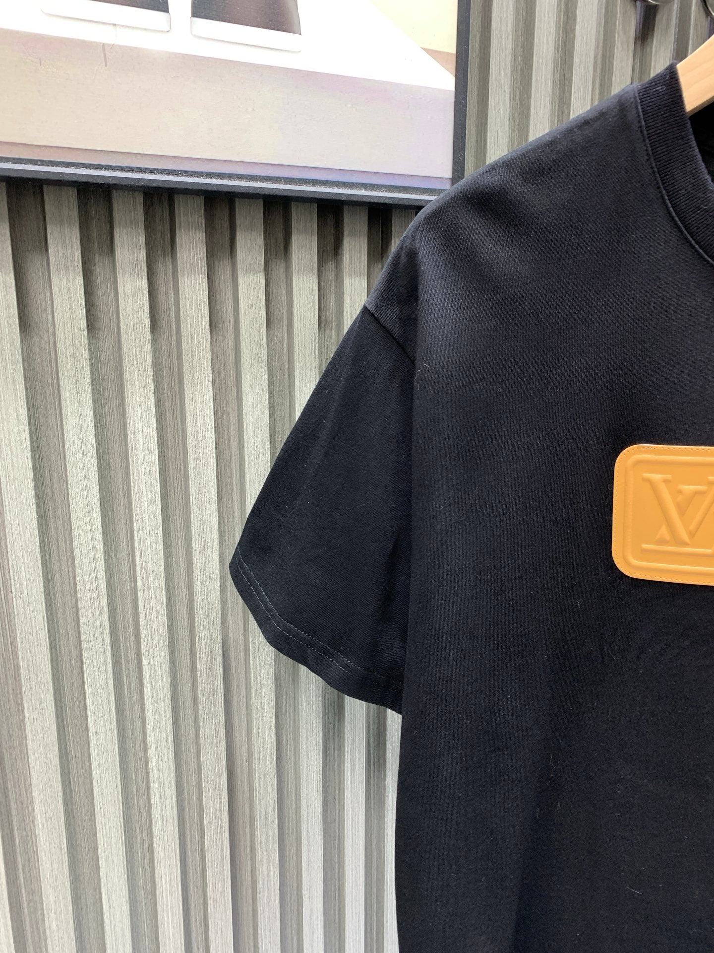 Louis Vuitton black T-shirt shoulder with gold logo detail
