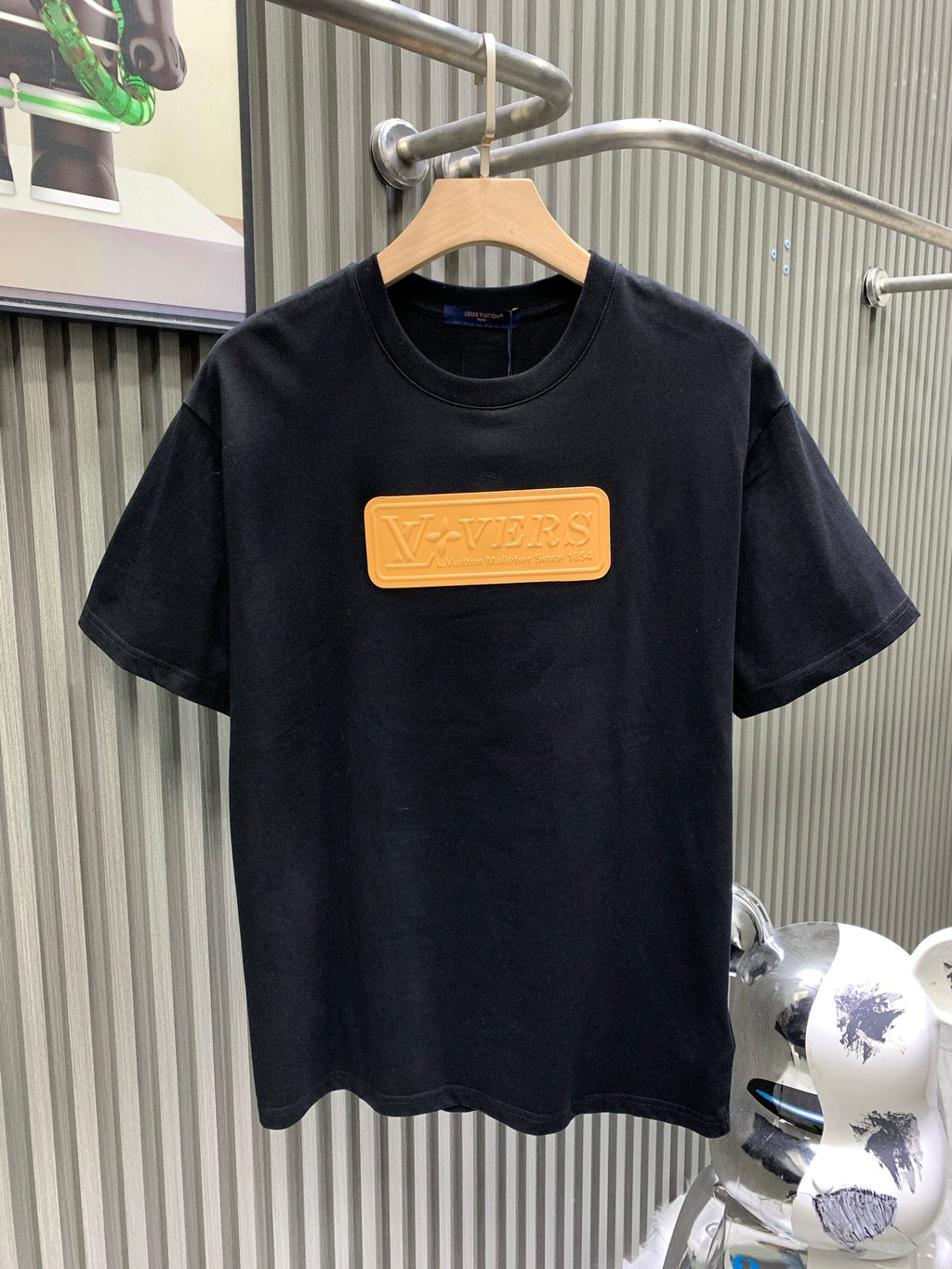 Louis Vuitton black short-sleeve T-shirt with gold rectangular logo patch